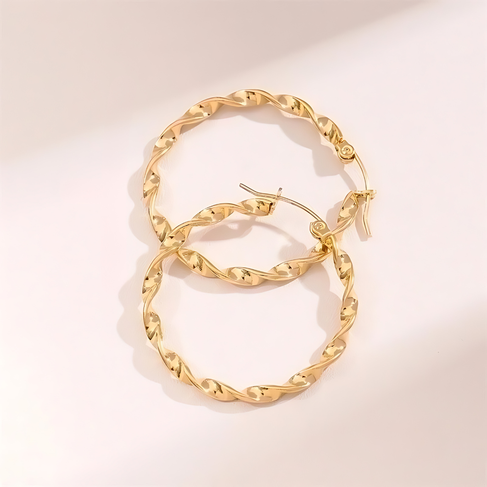 Tourbillon Ohrringe Gold