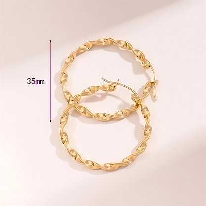 Tourbillon Ohrringe Gold