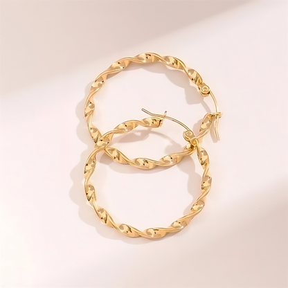Tourbillon Ohrringe Gold